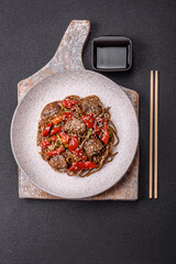 Delicious spicy Asian food soba with buckwheat noodles, beef, vegetables