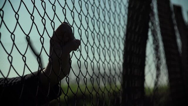 marginalization, immigration barriers. woman hands seeking freedom and life