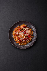 Delicious Asian food udon with noodles, chicken, hot pepper, vegetables