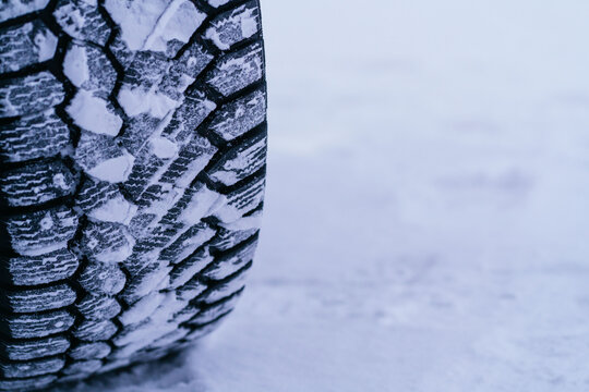 Close-up of a snow-covered tire in Swedish Lapland winter