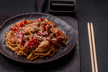 Delicious Asian food udon with noodles, chicken, hot pepper, vegetables
