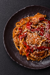 Delicious Asian food udon with noodles, chicken, hot pepper, vegetables