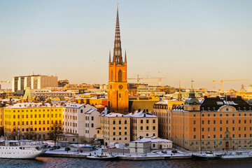 Historic Stockholm Waterfront with Snow-Covered Buildings