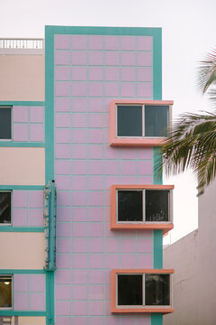 Pastel colored Art Deco building with contrasting windows