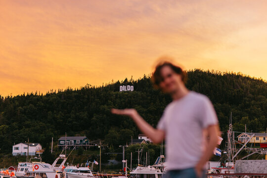Young man with humorous gesture in Dildo, Newfoundland