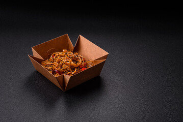 Delicious Asian food udon with noodles, chicken, hot pepper, vegetables