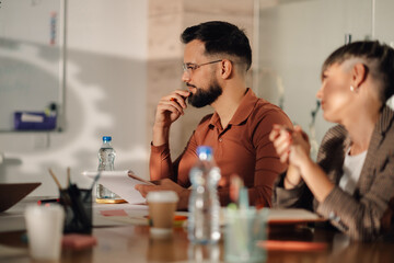 Business people brainstorming during meeting in office boardroom