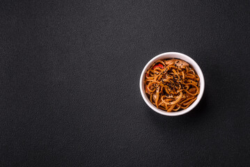 Delicious Asian food udon with noodles, chicken, hot pepper, vegetables