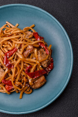 Delicious Asian food udon with noodles, chicken, hot pepper, vegetables