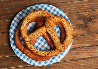 plate with german pretzels on wooden background