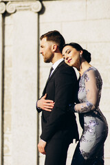 Young couple on their wedding anniversary having photoshoot on the roof of the theatre