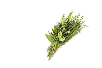 A bunch of fresh green Provence herbs on a white background