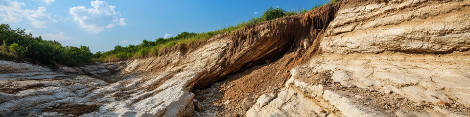 Naklejka premium Eroded Hillside with Stratified Sedimentary Layers