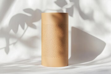 Obraz premium Stylish speaker with textured surface casting soft shadows on fa
