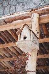 the old wooden house with a red roof