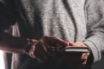 man writing in a notepad.