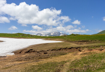 the beginning of the spring period in mountainous areas, remnants of snow cover and panoramic views...