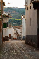 Cobbled and narrow alley in a Spanish town.