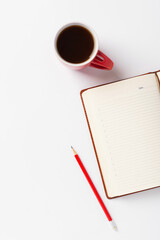 Brown notebook, red pencil and red cup with coffee on white background. Morning plans for the day,...