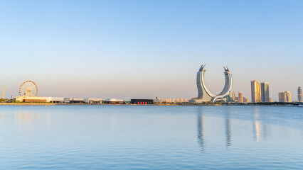 the newly developed lusail city with winter wonderland and crescent tower in the background.