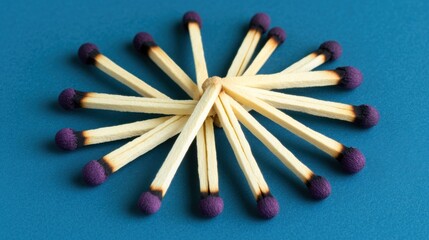 Used matches arranged in a circle on a blue background.