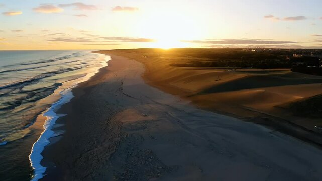 video of aerial view of a golden sunset over Miacomet Beach a breathtaking natural landmark in stunning 4K 