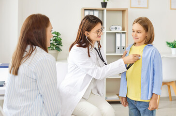 Pediatrician woman checking, stethoscope listening to child heart, lungs, family doctor helping in clinic, hospital female medical practitioner consulting boy, mother parent, general practitioner 