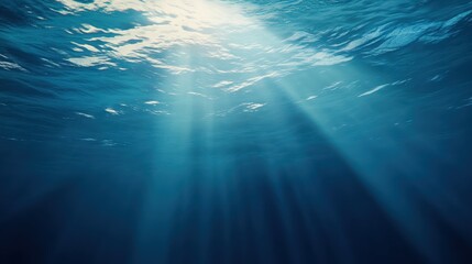 Deep ocean with a focus on the rays of sunlight streaming down from the surface