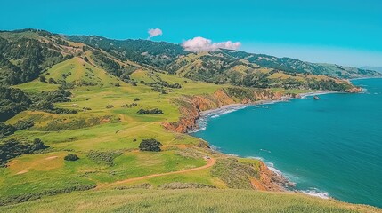 Coastal California landscape green hills meet ocean waves.  Perfect for travel brochures