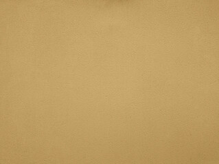 Ivory beige yellow paint wall texture or background with grainy, textured, gotele, scratched, rough and scratchy effect for typical Mediterranean house, chalet and villa exteriors in Spain.