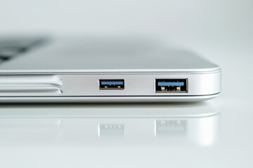 USB drive connected to sleek laptop port showcasing modern technology in high resolution