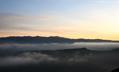 Sunrise over the clouds in rural Catalonia with views of La Mola mountain