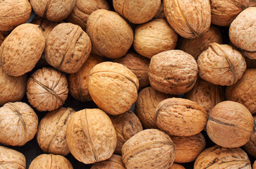 Top view of whole walnuts as background texture