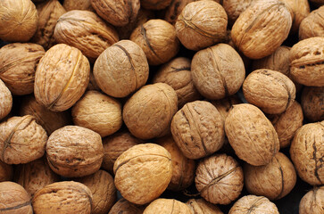 Top view of whole walnuts as background texture