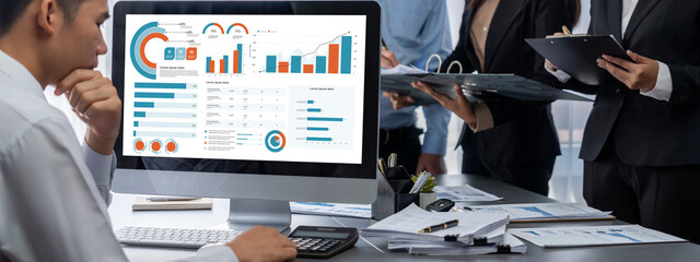 Business intelligence and data analysis concept. Analyst team working on financial data analysis...