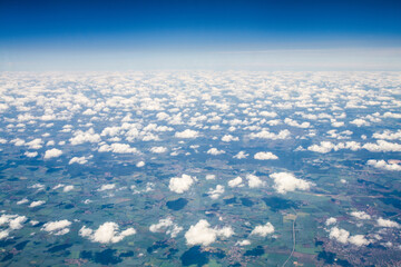 beautiful thick clouds in the sky from the height of the flight of the plane with a view of the...