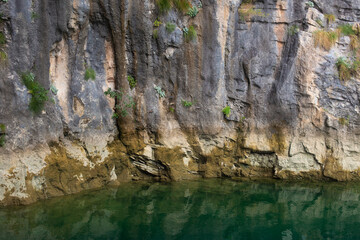 high rocky mountains on the banks of the river