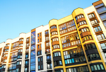 Fototapeta premium Residential condominium building. Modern complex of Apartment residential condo. Residential architecture exterior. Modern facade building. New House, Eco-friendly residential building.