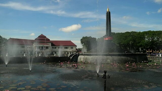 Alun-Alun Tugu is a round square located in front of the City Hall of Malang City, East Java. The square was built in 1920 by the Dutchman Thomas Karsten, surrounded by fountains and lotus ponds. 