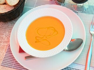 Traditional Andalusian gazpacho, vegetable soup puree seasoned with olive oil, traditionally served cold with glass of red wine. Spanish cuisine