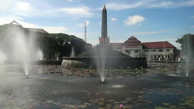 Alun-Alun Tugu is a round square located in front of the City Hall of Malang City, East Java. The square was built in 1920 by the Dutchman Thomas Karsten, surrounded by fountains and lotus ponds. 
