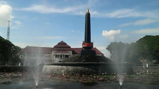 Alun-Alun Tugu is a round square located in front of the City Hall of Malang City, East Java. The square was built in 1920 by the Dutchman Thomas Karsten, surrounded by fountains and lotus ponds. 