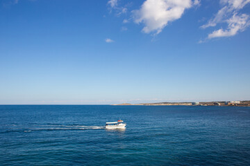 a beautiful ship is sailing in the blue sea