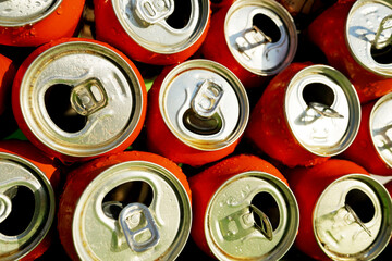 Opened Coke Cans background, texture. Open drink soda cans close up, top view. Open coke can,...