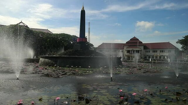 Alun-Alun Tugu is a round square located in front of the City Hall of Malang City, East Java. The square was built in 1920 by the Dutchman Thomas Karsten, surrounded by fountains and lotus ponds. 