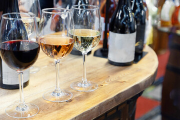 many glasses with strong alcohol stand on the table ready to drink