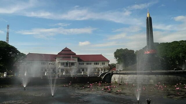 Alun-Alun Tugu is a round square located in front of the City Hall of Malang City, East Java. The square was built in 1920 by the Dutchman Thomas Karsten, surrounded by fountains and lotus ponds. 