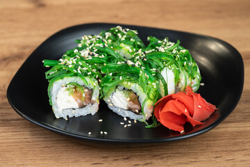 delicious traditional Japanese sushi and rolls on a plate