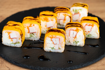delicious traditional Japanese sushi and rolls on a plate