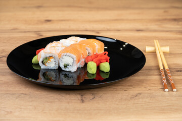 delicious traditional Japanese sushi and rolls on a plate